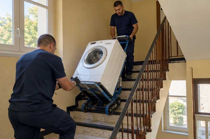 Lave-linge sur diable monte-escalier : chantier Rue de Bellevue